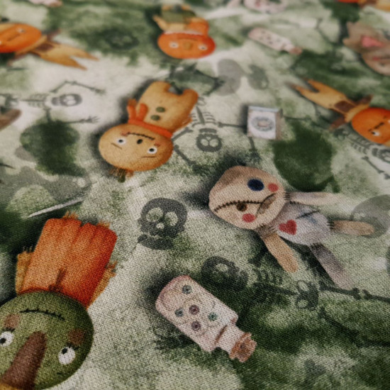 Cotton Halloween Voodoo Dolls fabric - Halloween-themed organic cotton poplin fabric with fun drawings of voodoo dolls, jars with eyes... on a background in shades of green with shadows of skeletons and ghosts. The fabric is 150cm wide and its composition