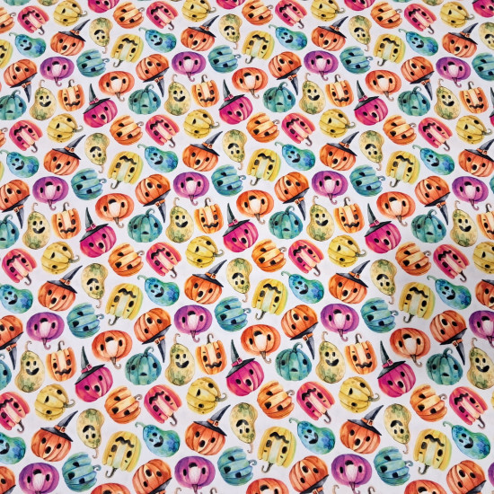 Cotton Halloween Pumpkins Colors Spooky fabric - Cotton poplin fabric with Halloween-themed designs featuring colorful pumpkins with faces and decorated hats on a white background. The fabric is 150 cm wide and is made of 100% cotton.