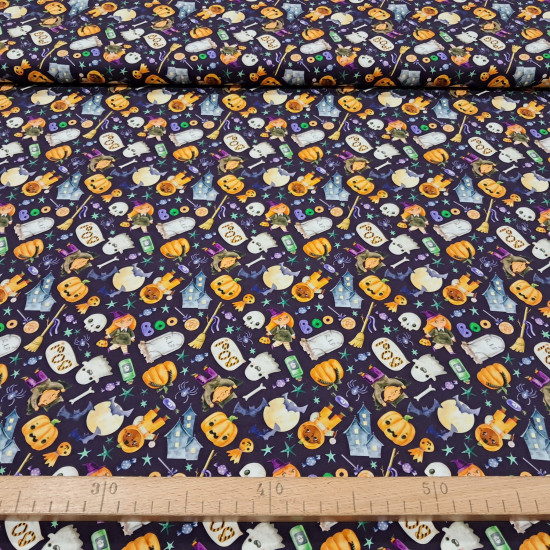 Cotton Halloween Boo Spooky fabric - Halloween-themed cotton poplin fabric with drawings of ghosts, pumpkins, spiders, bats, candy, and more on a violet background. The fabric is 150 cm wide and is made of 100% cotton.