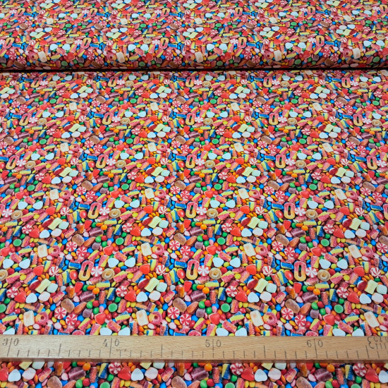 Cotton Candy 3D Effect fabric Multicolor cotton poplin fabric with a photographic print of sweets and candies.