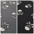 Cotton Pirate Skulls fabric - Cotton fabric with drawings of white pirate skulls on a black background and also in grey background. The fabric is 145cm wide and its composition 100% cotton.