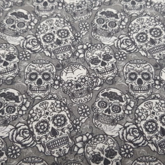 Cotton Skulls Whiteblack Tiny fabric - Cotton fabric digital printing with small drawings of Mexican skulls with black and white floral decorations on a gray background. The fabric is 140cm wide and its composition is 100% cotton