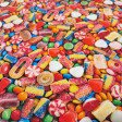 Cotton Candy 3D Effect fabric Multicolor cotton poplin fabric with a photographic print of sweets and candies.