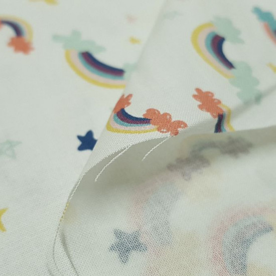 Cotton Clouds Colors and Stars fabric - Children's themed cotton fabric with colorful cloud and rainbow drawings on a light background with colored stars. The fabric is 150cm wide and its composition 100% cotton.