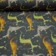 Cretonne Cotton Dragons Gray fabric - Cretonne-type cotton fabric, a stronger fabric than cotton poplin, with drawings of green, orange and gray magic dragons on a dark gray background with colored stars. It could be a very suitable fabric for the festiva