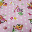 Cotton Balls Chocolate M Pink fabric - Very funny cotton poplin fabric with drawings of the famous colorful M&Ms® chocolate balls on a pink background with white polka dots. The fabric is 150cm wide and its composition 100% cotton.
