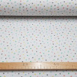 Cotton Stars Asterisks Colors fabric - Poplin organic cotton fabric with star patterns in different colors asterisk on a white background. Fabric made in Spain. The fabric is 150cm wide and its composition is 100% cotton.