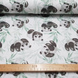Cotton Green Bamboo Pandas fabric - Children's cotton poplin fabric with drawings of panda bears on a background of green bamboo canes. Fabric made in Spain. The fabric is 150cm wide and its composition is 100% cotton.