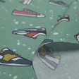Cotton Girls Sports Shoes fabric - Organic cotton poplin fabric with drawings of various models of running sneakers on a mint green background with white splashes. The fabric is 150cm wide and its composition is 100% cotton.