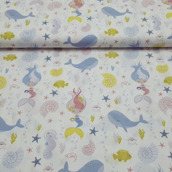Cotton Mermaid Shells fabric - Organic cotton poplin fabric with a child theme featuring drawings of mermaids, sea shells, puffer fish, corals, starfish, bubbles and more related to the marine world... all on a white background. The fabric is 150c