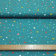 Cotton Hearts and Polka Dots Petrol Blue fabric - Cotton poplin fabric with colorful hearts and polka dots on a petrol blue background. The fabric is 150cm wide and its composition is 100% cotton.