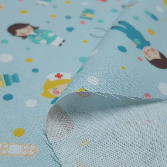 Cotton Medicine Hospital Light Blue fabric - Cotton poplin fabric with drawings of health personnel (nursing, surgeons, doctors ...) on a light blue background with drawings of syringes, hearts, pills, thermometers, bandages... The fabric is 150cm wide an