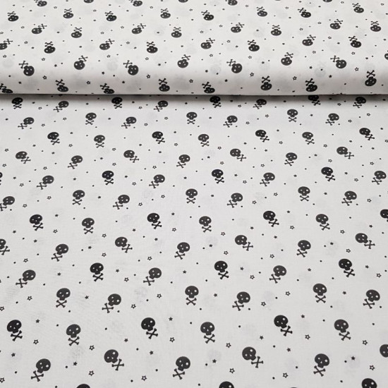 Cotton Skulls Little Stars Black fabric - Cotton poplin fabric with drawings of small skulls and stars in black and dark gray colors. The fabric is 150cm wide and its composition is 100% cotton.