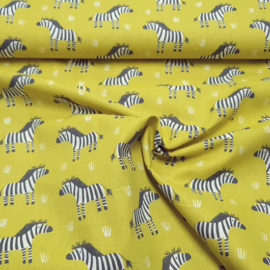 Cotton Zebra Lime Yellow fabric - Children's cotton fabric with zebra patterns on a striking lime yellow background. The fabric is 150cm wide and its composition is 100% cotton.  