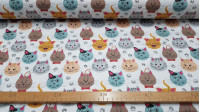 Tela Algodón Caras Gatos Huellas - Tela de algodón satinada con dibujos de caras de gatos divertidas y huellas sobre un fondo blanco. La tela mide 140cm de ancho y su composición 100% algodón.