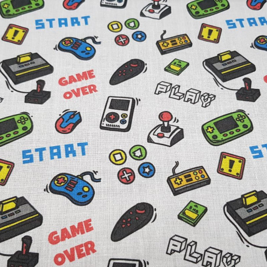 Cotton Video Game Controllers fabric - Cotton fabric digital printing with drawings of classic game controllers on a white background, in which phrases of 