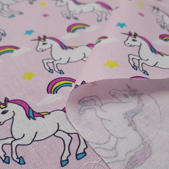 Cotton Unicorn Stars Pink fabric - Digital printed children's cotton fabric with drawings of unicorns, rainbows and stars on a pink background. The fabric is 150cm wide and its composition is 100% cotton.