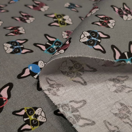 Cotton Bulldogs Glasses fabric - Cotton fabric digital printing with drawings of the faces of bulldog puppies with colored glasses on a gray background. The fabric is 140cm wide and its composition is 100% cotton.