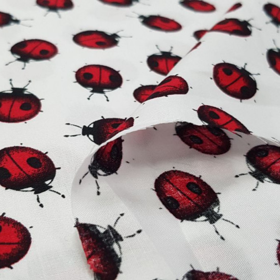 Cotton Ladybugs fabric - Cotton poplin fabric with drawings of ladybugs on a white background. The fabric is 145cm wide and its composition is 100% cotton.