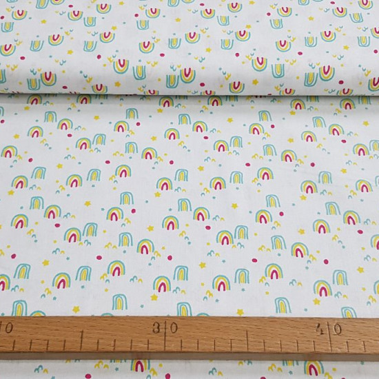 Cotton Rainbow Stars fabric - Children's cotton fabric with drawings of rainbow lines, stars, polka dots... on a white background. The fabric is 150cm wide and its composition is 100% cotton.
