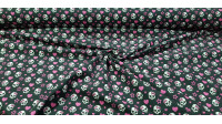 Tela Algodón Calaveras Lacitos Rosas - Tela de algodón con dibujos de calaveras con lacitos rosas sobre un fondo negro con corazones y estrellas de color rosa. La tela mide 140cm de ancho y su composición 100% algodón.