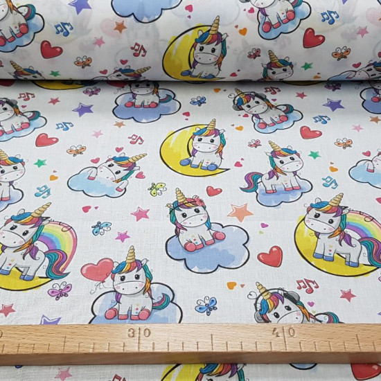 Cotton Unicorns Music fabric - Cotton fabric for children with pictures of unicorns listening to music on a white background with colorful musical notes, hearts, butterflies... The fabric is 150cm wide and its composition is 100% cotton.