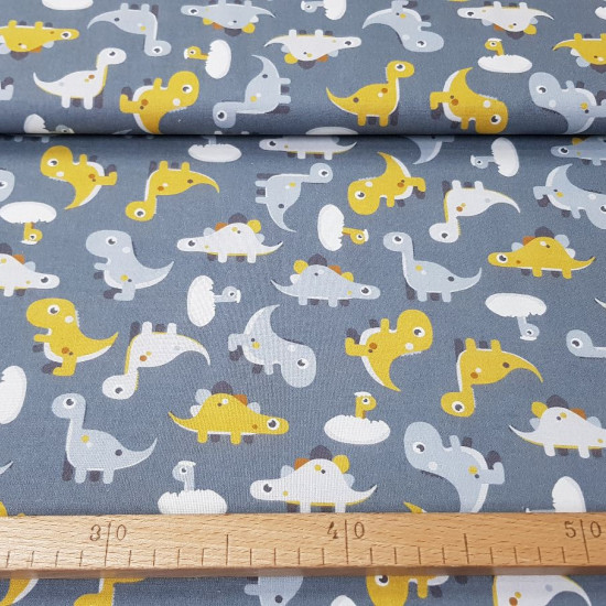 Cotton Dinosaurs Toy Gray fabric - Cotton fabric with drawings of toy dinosaurs on a gray background. The fabric is 150cm wide and its composition is 100% cotton.