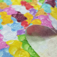 Cotton Gummy Bears fabric - Cotton fabric with drawings of colored gummy bears. The fabric is 150cm wide and its composition is 100% cotton.