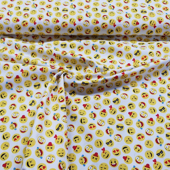 Cotton Emoticons Mini fabric - Poplin cotton fabric with drawings of faces or emoticons on a white background. The fabric is 140cm wide and its composition is 100% cotton.