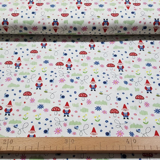 Cotton Forest Gnomes fabric - Cotton poplin fabric with drawings of gnomes in the forest, with mushrooms, flowers, snails ... The fabric is 140cm wide and its composition is 100% cotton.