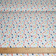 Tela Algodón Números Colores - Tela de algodón popelín orgánico (GOTS) con dibujos de números de colores sobre un fondo blanco. La tela mide 150cm de ancho y su composición 100% algodón.