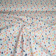 Cotton Numbers Colors fabric - Organic cotton poplin (GOTS) fabric with colored number patterns on a white background. The fabric is 150cm wide and its composition is 100% cotton.