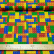 Cotton Blocks Construction Colors fabric - Poplin cotton fabric patterned with colorful building blocks toy, which reminds us to the famous Lego®. The fabric is 150cm wide and its composition is 100% cotton.