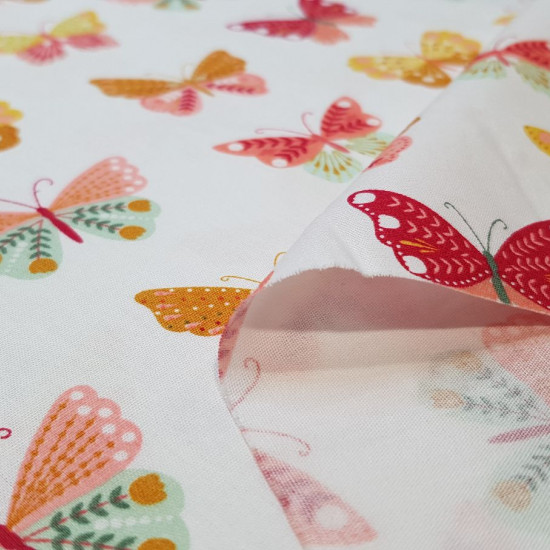 Cotton Butterflies Multicolor fabric - Cotton poplin fabric with drawings of colored butterflies on two color backgrounds to choose from. The fabric is 150cm wide and its composition is 100% cotton.