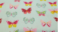 Tela Algodón Mariposas Multicolor - Tela de popelín algodón con dibujos de mariposas de colores sobre dos fondos de color a elegir. La tela mide 150cm de ancho y su composición 100% algodón.