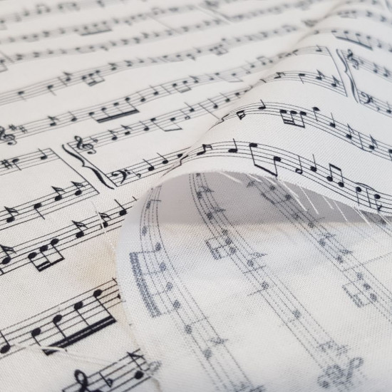 Tela Algodón Partituras Música - Tela de popelín algodón con dibujos de partituras musicales sobre fondo blanco. La tela mide 150cm de ancho y su composición 100% algodón.