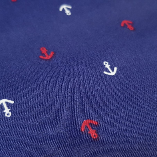 Cotton Anchors fabric - Cotton fabric with drawings of small white and red ship anchors on a blue background. Marine-themed cotton fabric. The fabric measures 145cm wide and its composition is 100% cotton.