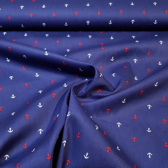 Cotton Anchors fabric - Cotton fabric with drawings of small white and red ship anchors on a blue background. Marine-themed cotton fabric. The fabric measures 145cm wide and its composition is 100% cotton.