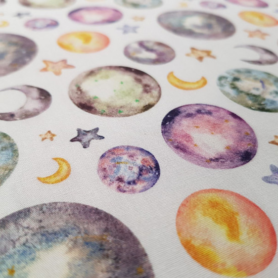 Cotton Moons and Stars fabric - Cotton poplin fabric with drawings of moons in their different lunar phases and stars in various shades of color on a white background. The fabric is 150cm wide and its composition is 100% cotton.