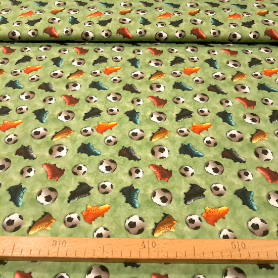 Cotton Soccer Balls 3D Effect fabric Cotton Soccer Balls 3D Effect fabric - 3D-effect cotton poplin fabric with soccer balls and multicolored sneakers on a mottled green background reminiscent of grass. The fabric is 150 cm wide and is made of 100% cotton.