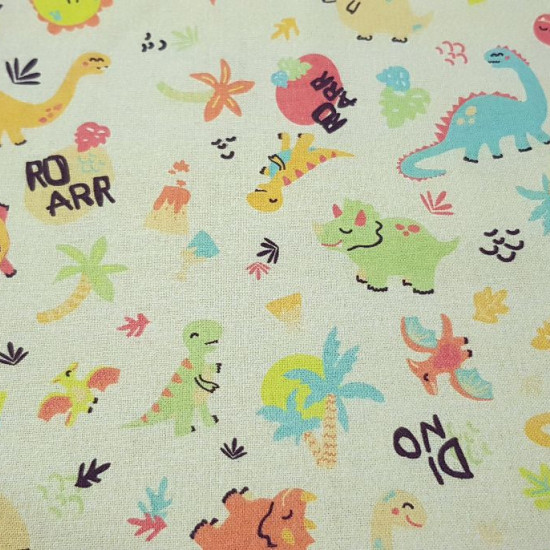 Cotton Dinosaurs Yellow fabric - Cotton fabric with drawings of colorful dinosaurs on a light yellow background with palm trees, volcanoes, vegetation... The fabric is 150cm wide and its composition is 100% cotton.