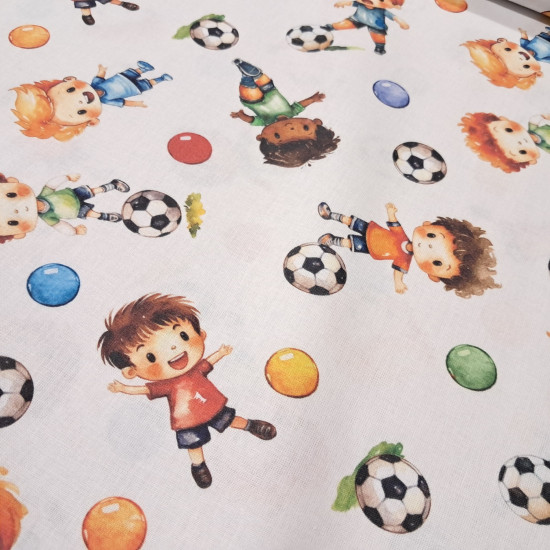 Cotton Playing Soccer fabric - Cotton poplin fabric with a children's theme featuring children playing soccer on a white background. The fabric is 150 cm wide and is made of 100% cotton.