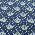 Cotton Wolves Glasses Triangles fabric - Cotton fabric with drawings of wolf faces with glasses on a dark blue background with white triangles around it. The fabric is 150cm wide and its composition is 100% cotton.