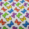 Cotton Butterflies Small Colors fabric - Satin cotton fabric with drawings of colorful butterflies on a white background. The fabric is 140cm wide and its composition is 100% cotton.