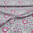 Cotton Pets Bridget Hearts fabric - Cotton fabric licensed Universal Pictures with drawings of the dog Bridget from the movie Pets on a gray background with gold and fuchsia hearts. The fabric is 150cm wide and its composition is 100% cotton.