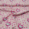 Cotton Pets Bridget Hearts Pink fabric - Cotton fabric licensed Universal Pictures with drawings of the dog Bridget from the movie Pets on a pink background with gold and fuchsia hearts. The fabric is 150cm wide and its composition is 100% cotton.