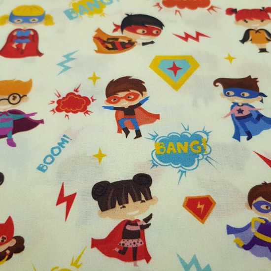 Cotton Superheroes Kids fabric - Digital print cotton fabric with drawings of girls and boys dressed as superheroes with masks, capes... on a light yellow background with drawings of rays, onomatopoeia. The fabric is 140cm wide and its composition i