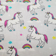 Tela Algodón Unicornios Estrellas Gris - Tela de algodón infantil impresión digital con dibujos de unicornios, estrellas y arcoiris sobre un fondo gris. La tela mide 145cm de ancho y su composición 100% algodón.