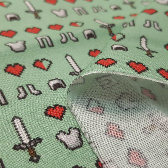 Tela Algodón Minecraft Símbolos Emojis - Tela de algodón licencia ancho americano con dibujos de símbolos y emojis del videojuego Minecraft sobre un fondo de color verde. La tela mide 110cm de ancho y su composición 100% algodón.