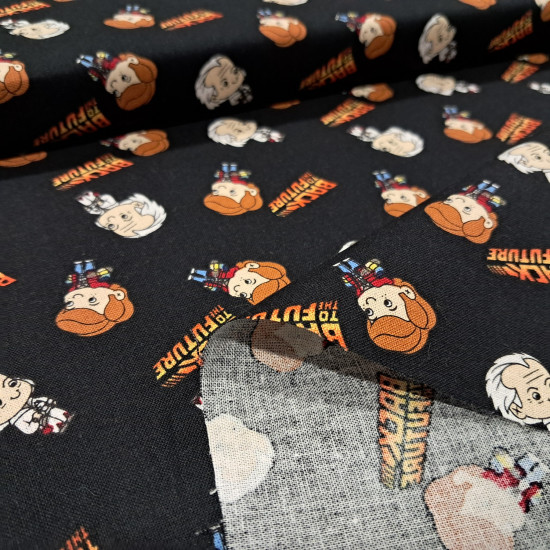 Cotton Back to the Future fabric - Patchwork poplin cotton fabric with drawings representing the characters Marty McFly and Doc from the long-awaited movie Back to the Future, and logos of the movie on a black background. The fabric measures 110cm wid
